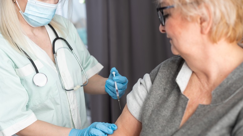 Older woman receiving vaccine