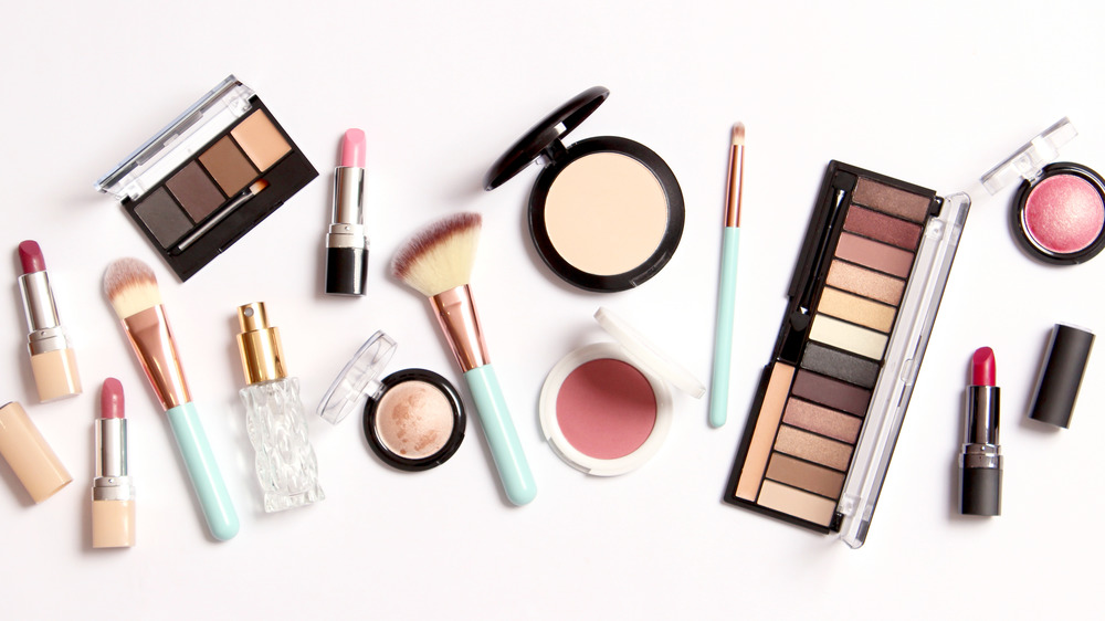Various cosmetic products on white background