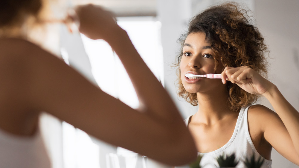 Woman brushing teeth 