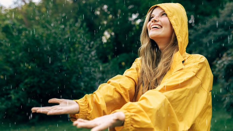 Smiling woman in the rain