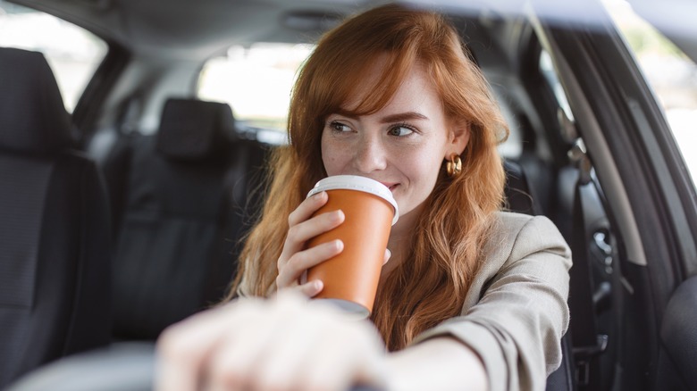 A woman drinking coffee
