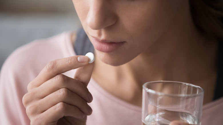 woman taking medication