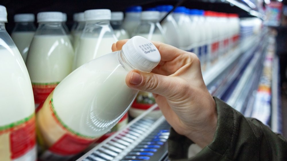 shopper checking milk date