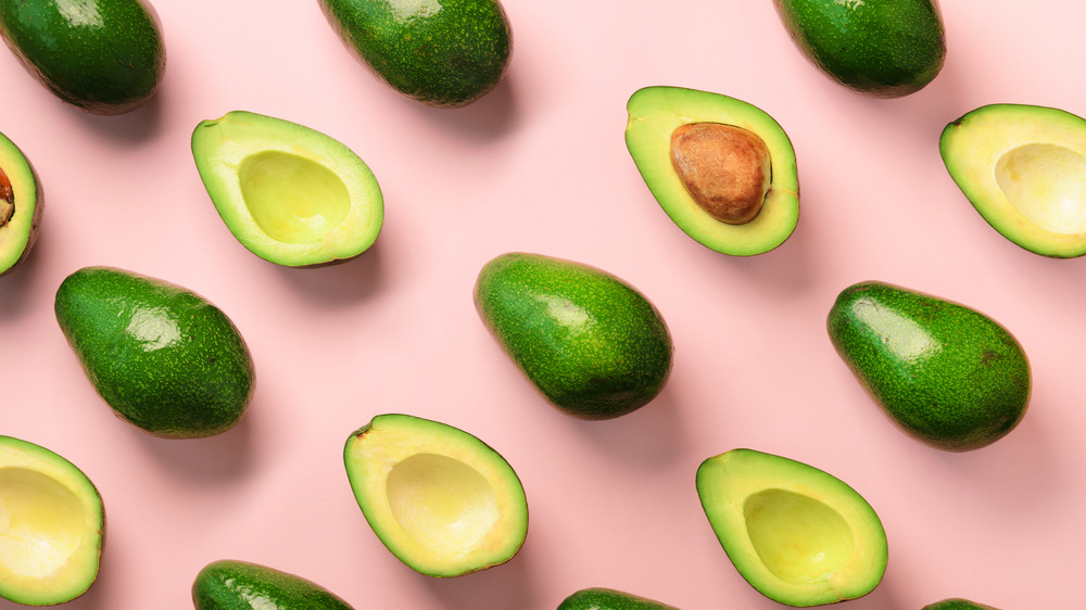 Avocados on a pink background 