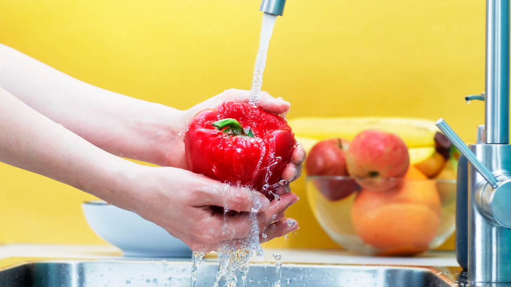 washing produce in sink