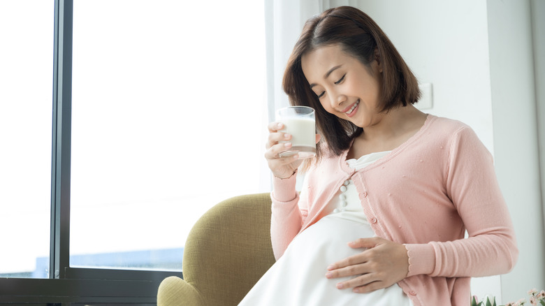 pregnant woman rubbing stomach