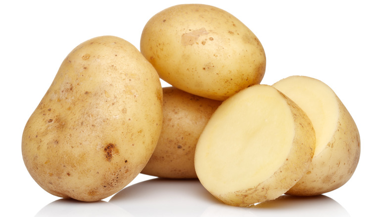 raw potatoes in an isolated white background 