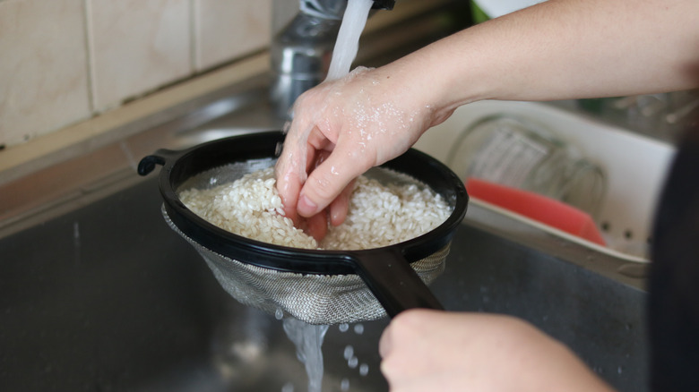 Someone rinses their rice