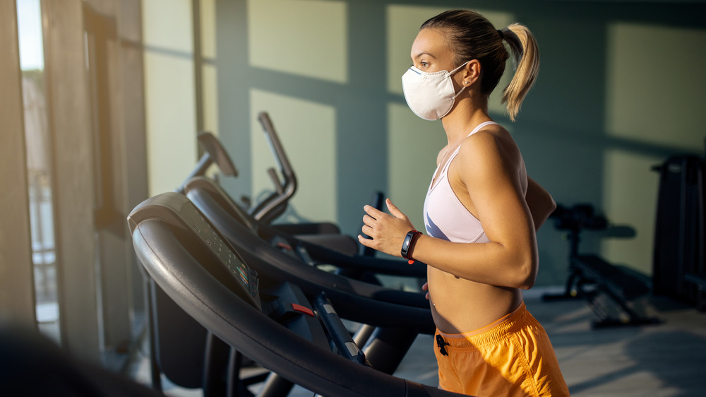 Woman wearing a mask at the gym