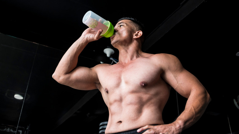 A man drinks pre workout