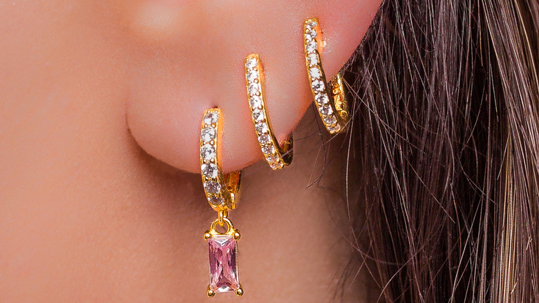 pierced ear with earrings