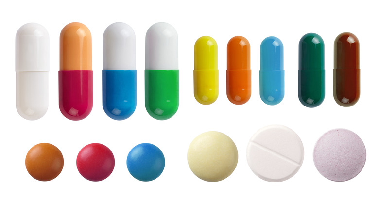 photo of different colors and sizes of pills 
