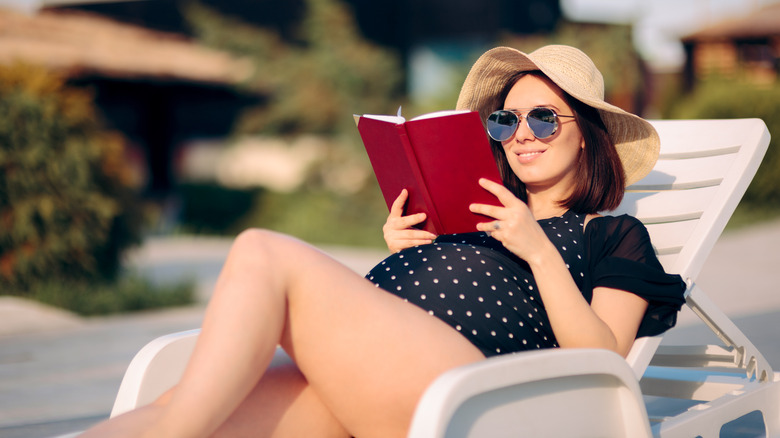 Pregnant woman reading a book