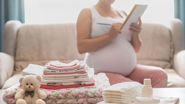 pregant woman writing