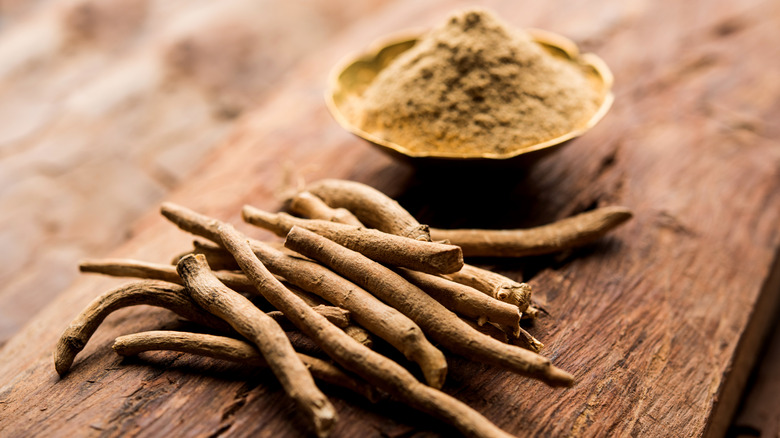 Ashwagandha root and powder on a table