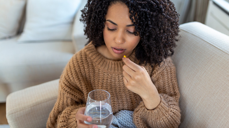 woman taking medication