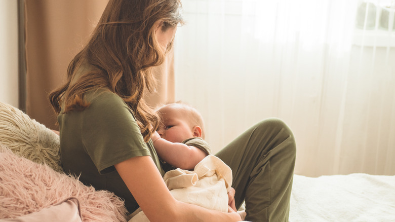 woman breastfeeding her child