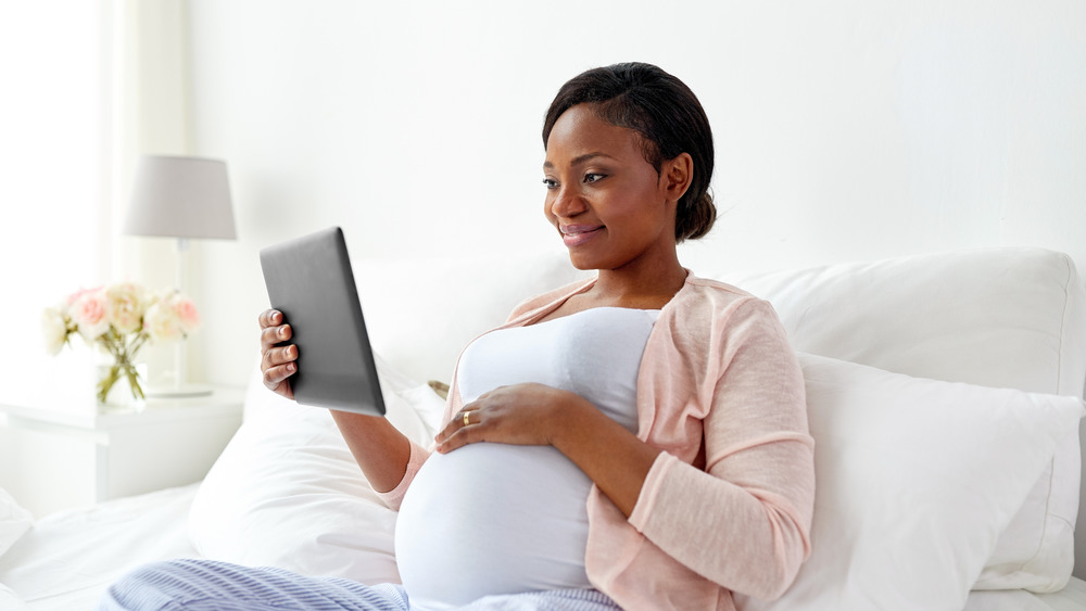 Pregnant woman in bed