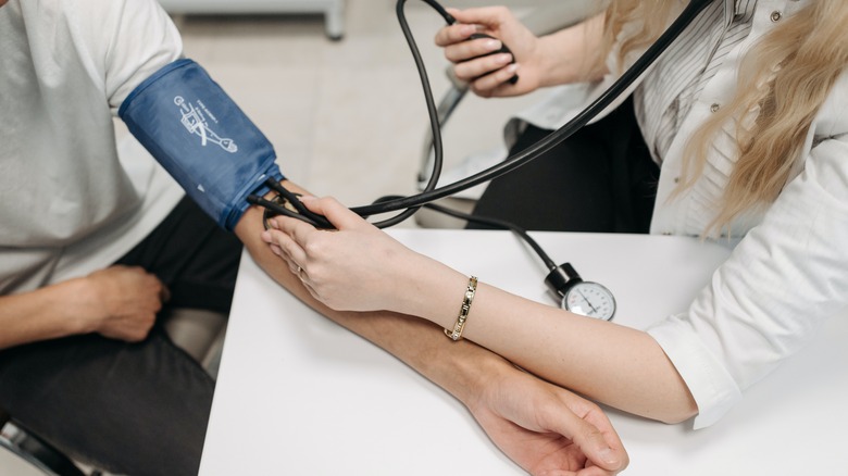 Doctor measuring blood pressure
