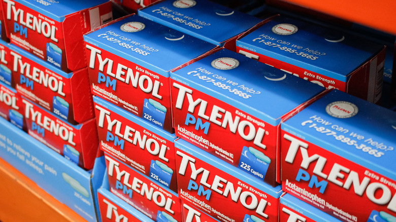 Boxes of Tylenol PM on a store shelf