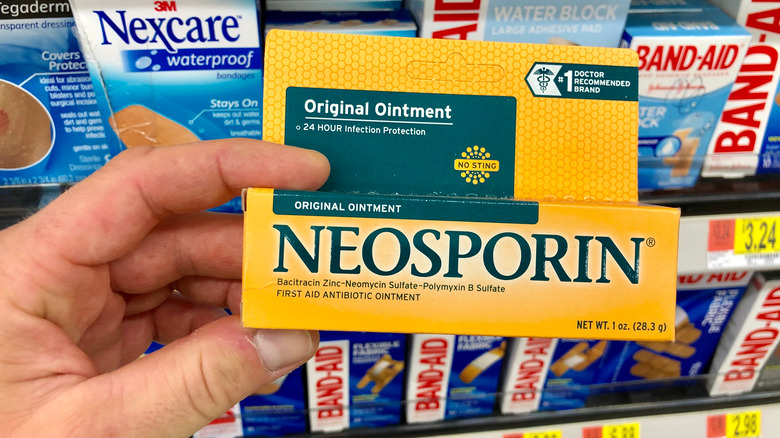 Person holding Neosporin