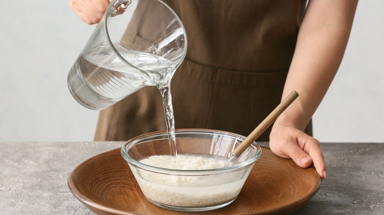 person making rice water