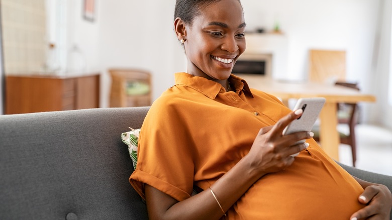 A pregnant woman on the couch