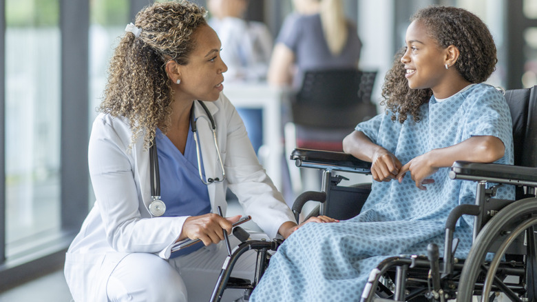 doctor talking to patient with multiple sclerosis