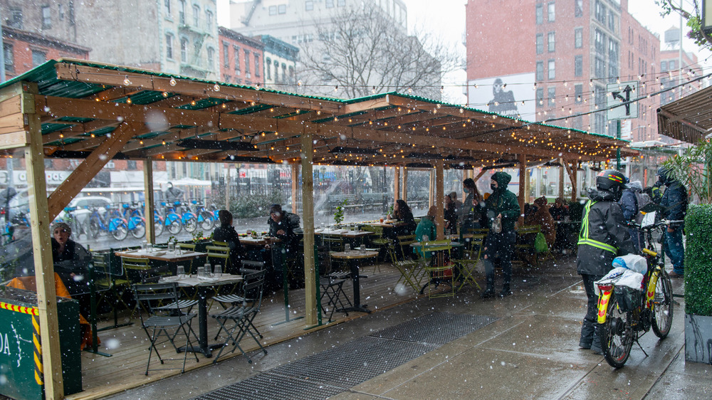 People dine outside in NYC in winter