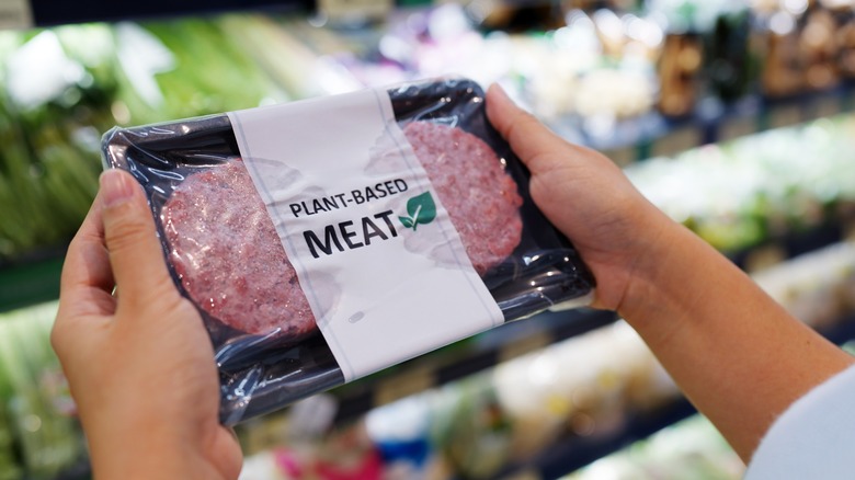 Person holding plant-based meat