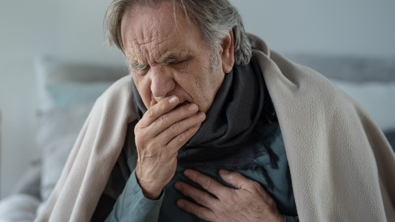 Sick older man coughing