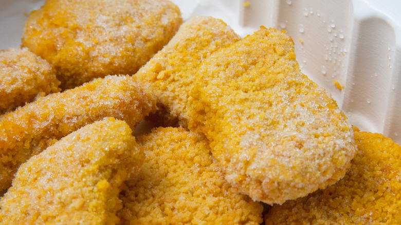 Frozen chicken nuggets in a container