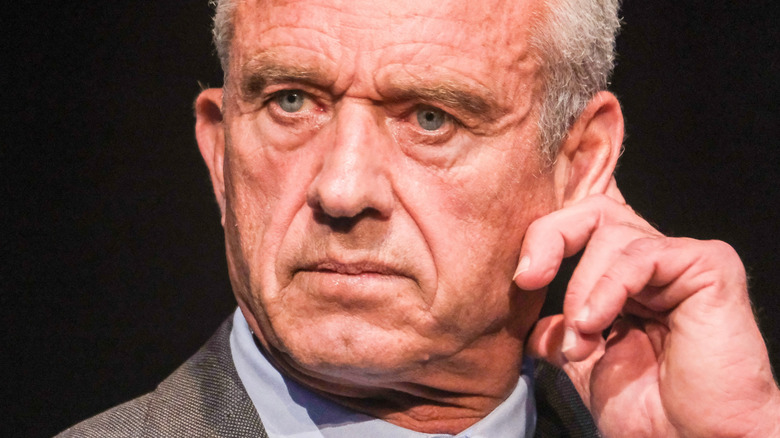 Robert Kennedy Jr. touching his left ear