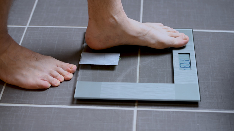 Man's feet on scale
