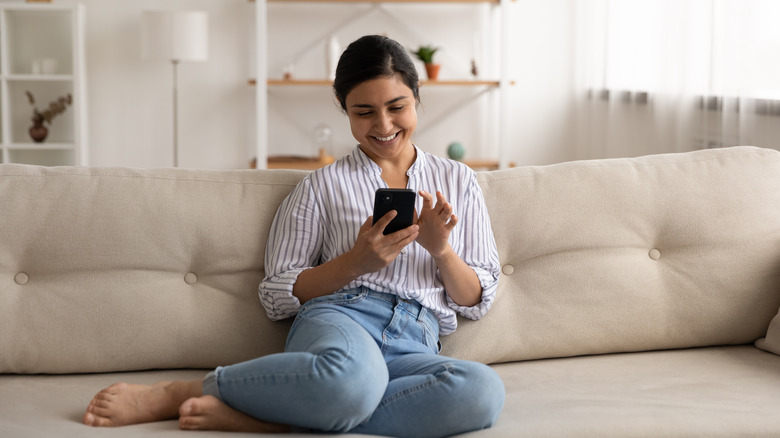 A woman is on her phone