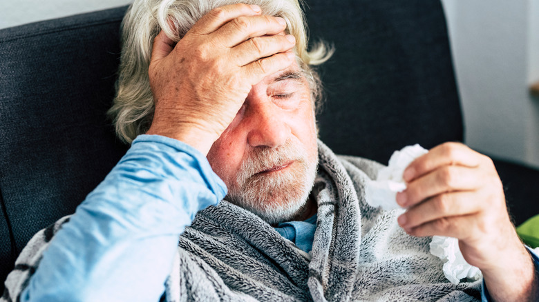 Man in bed with fever