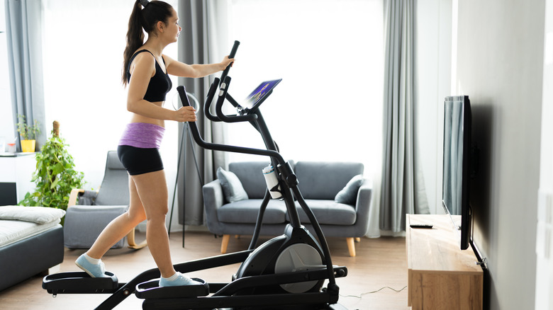 Woman using an elliptical machine