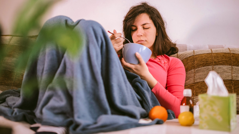 Woman with fever eating