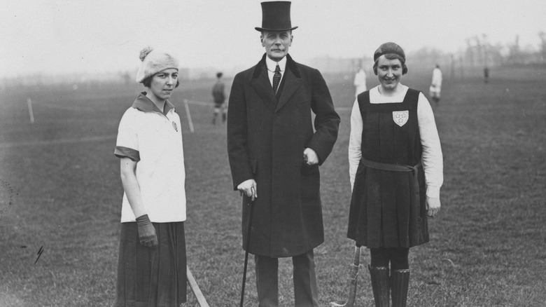 women in traditional hockey uniforms 