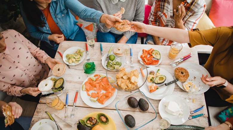 Overhead view of a group of friends preparing a meal together