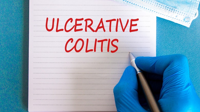 Gloved hand over words "ulcerative colitis"