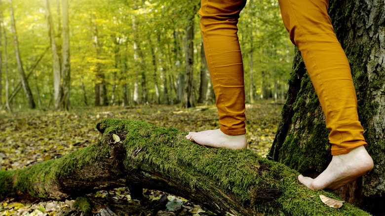 a person hiking barefoot 