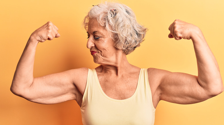 senior woman showing off muscles