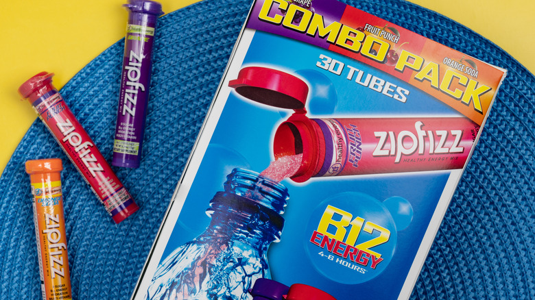 Zipfizz energy tubes on a blue placemat 