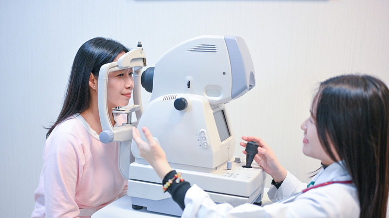 woman having retinal exam to check for diabetic retinopathy