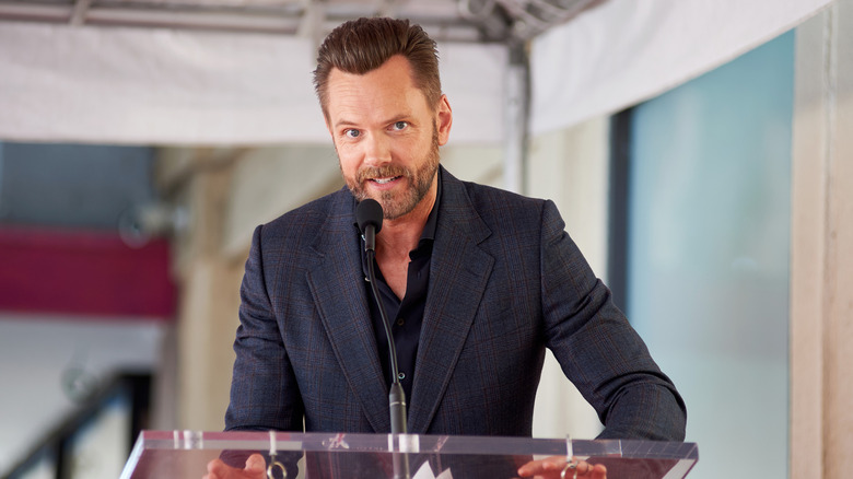 Joel McHale speaking at an event