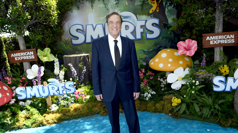 full-body shot of John Goodman at Smurfs premiere