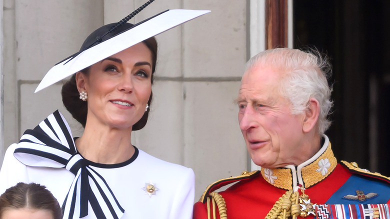 King Charles III and Kate Middleton talking
