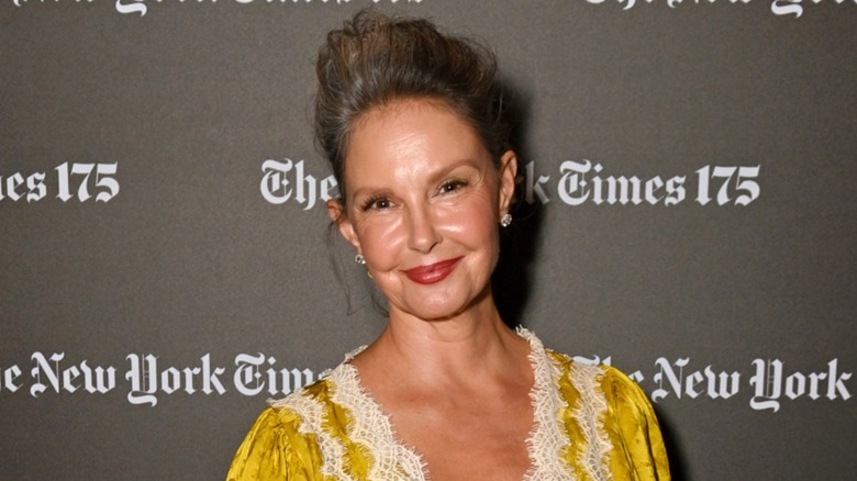 Ashley Judd in a yellow dress at a public event