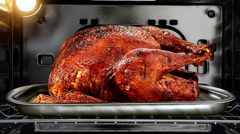 whole turkey roasting in the oven
